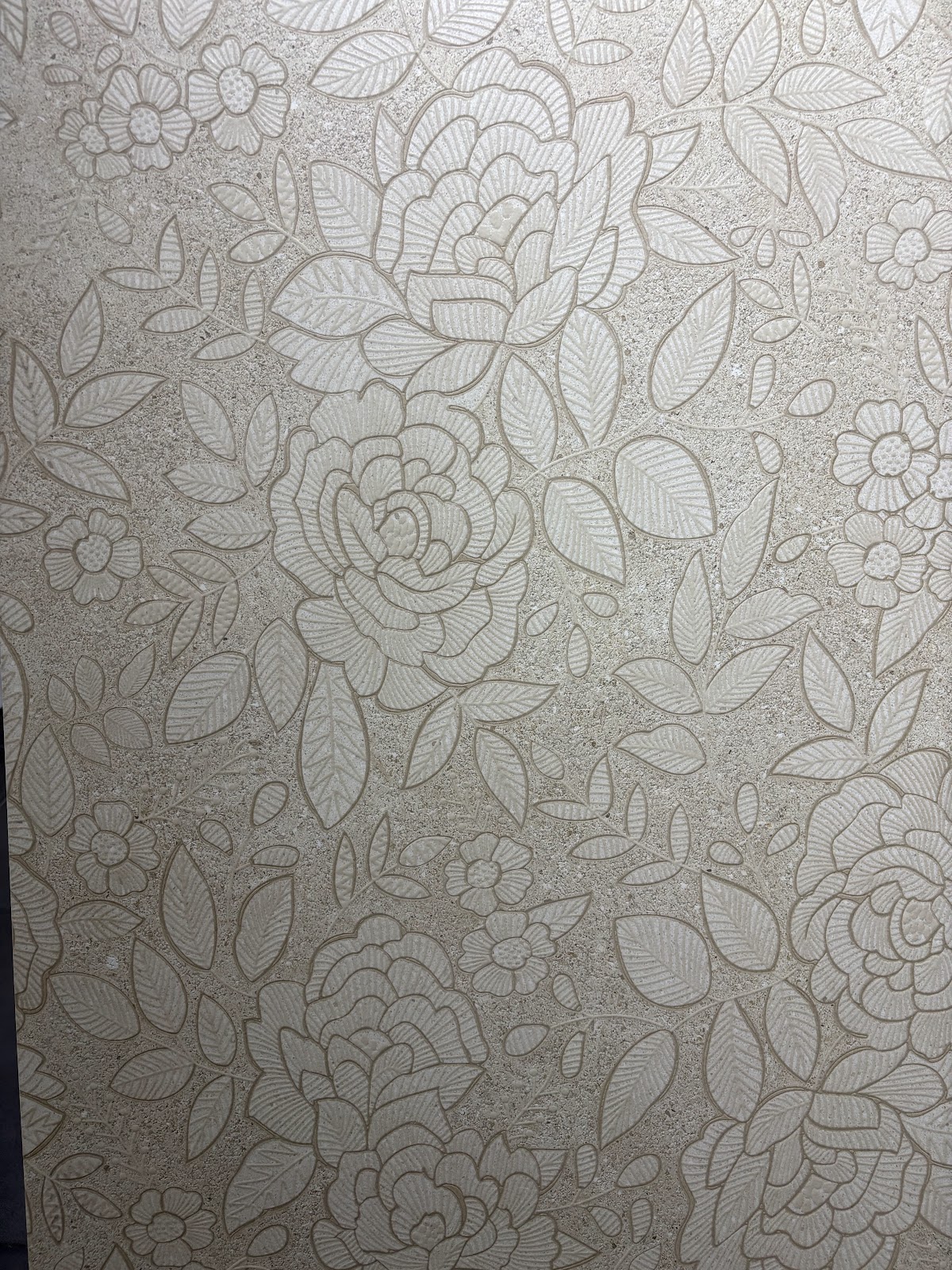 Close view of a finely detailed floral tile surface at World of Tile Noida
