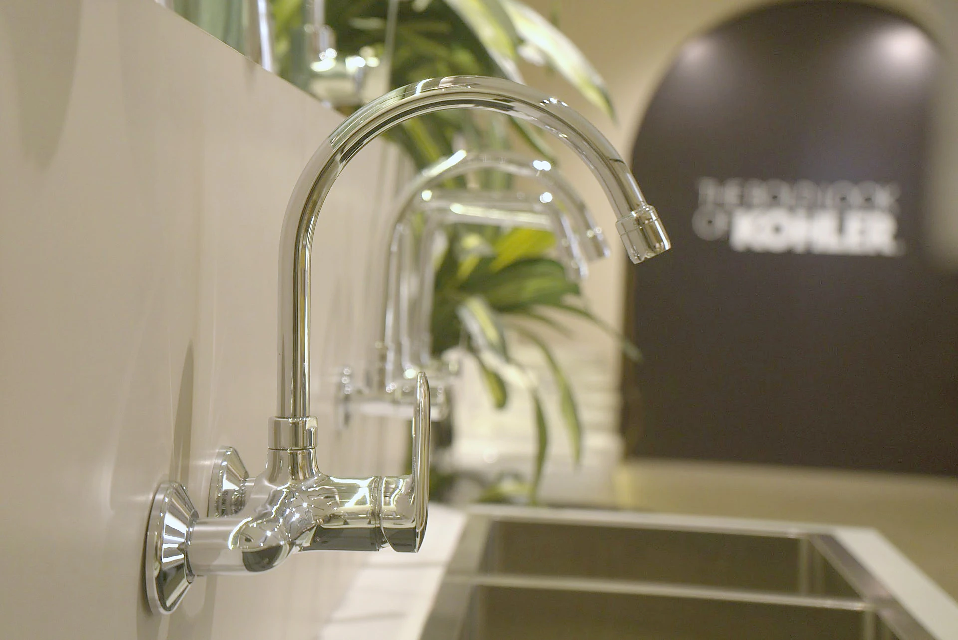 Chrome basin faucet with running water