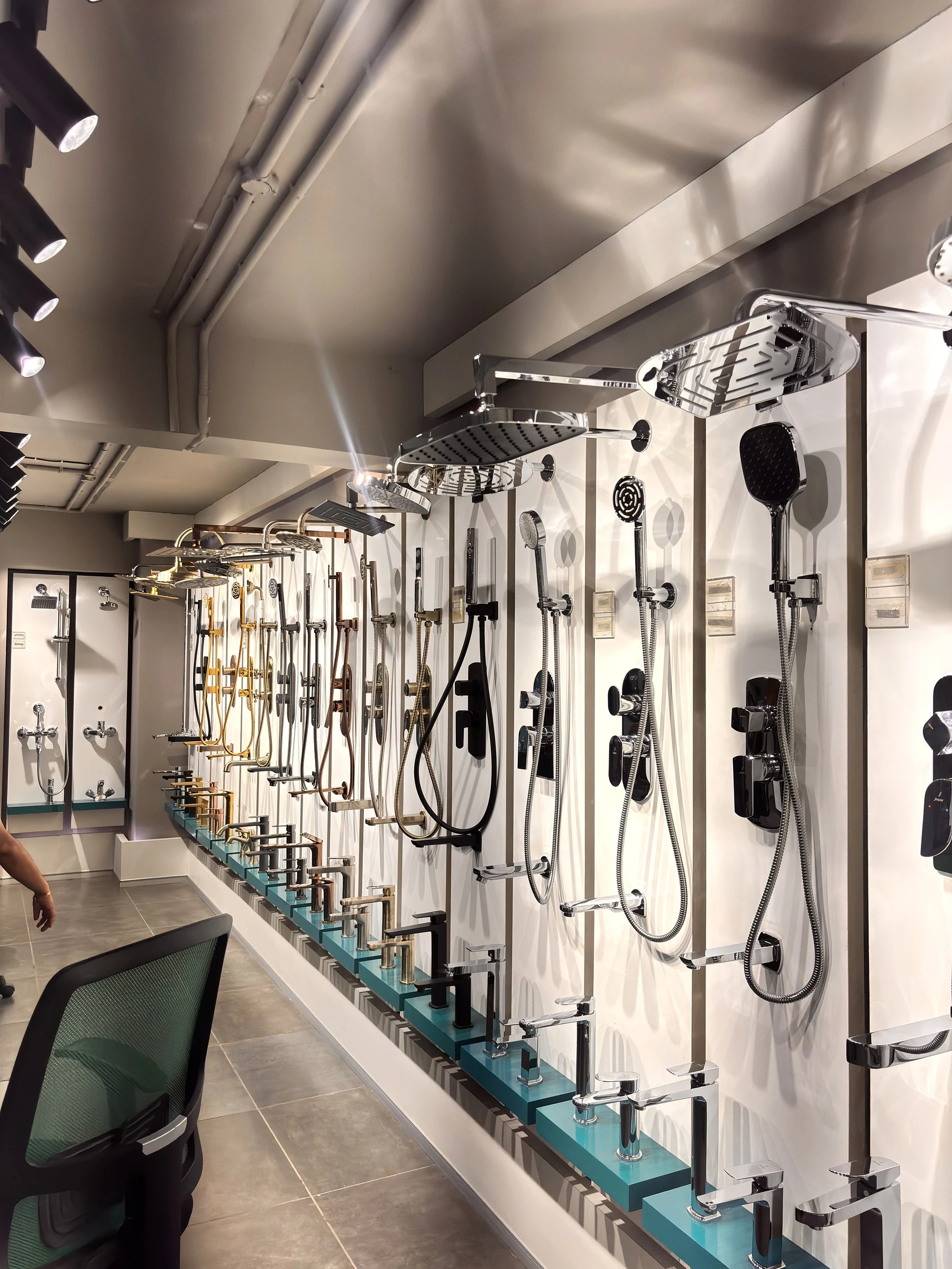 Jaquar shower and fittings display wall at the World of Tile showroom in Noida
