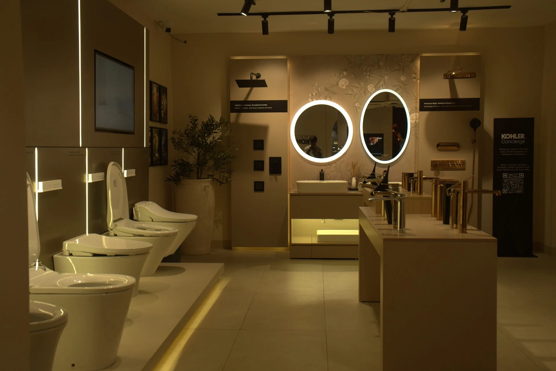 Warm toned Kohler bathroom setting with soft lighting and stone surfaces