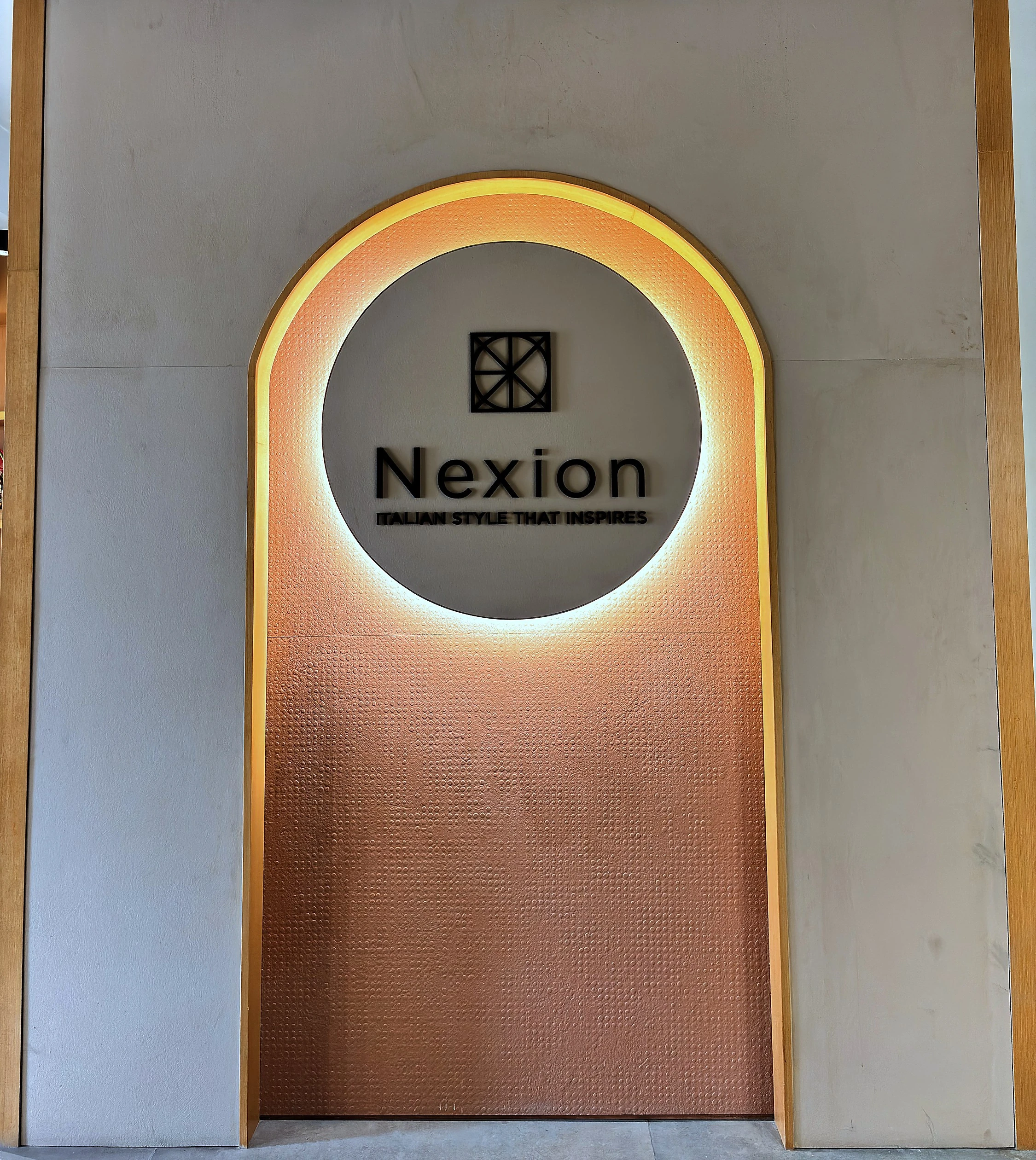 Architectural interior clad in large format Nexion surfaces with raking daylight