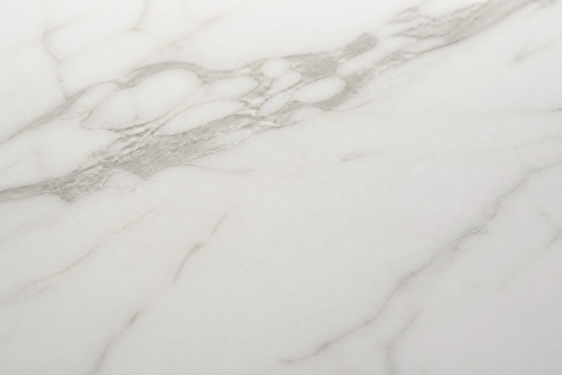Macro detail of a marble look porcelain surface showing veining and finish