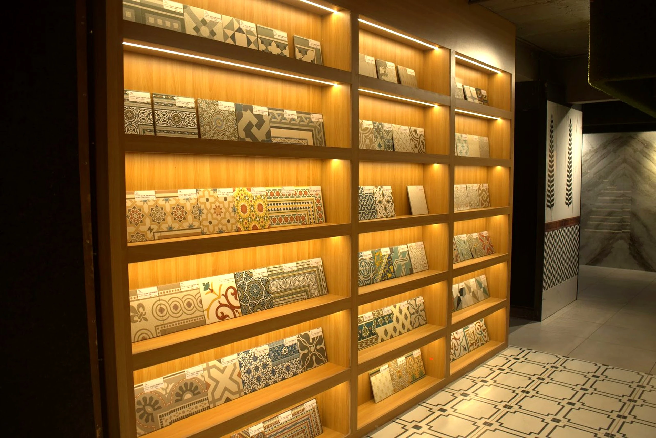 Backlit tile library wall with hundreds of surface samples